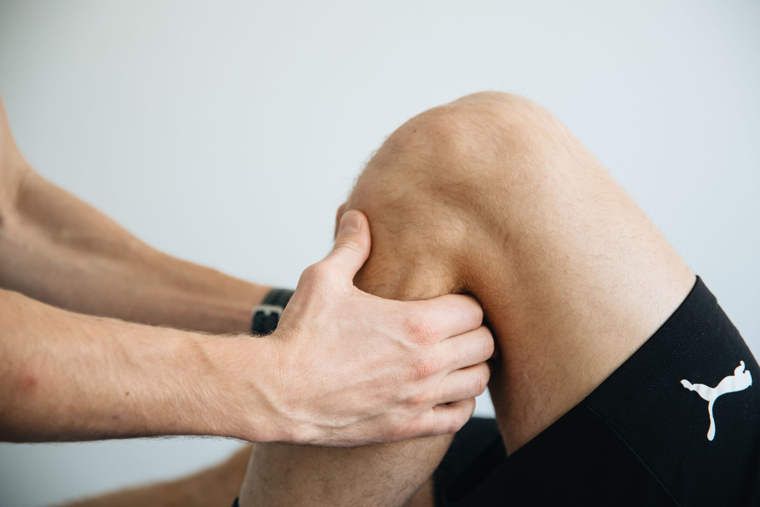 Physio Matt Beavis, treating a patients knee pain.