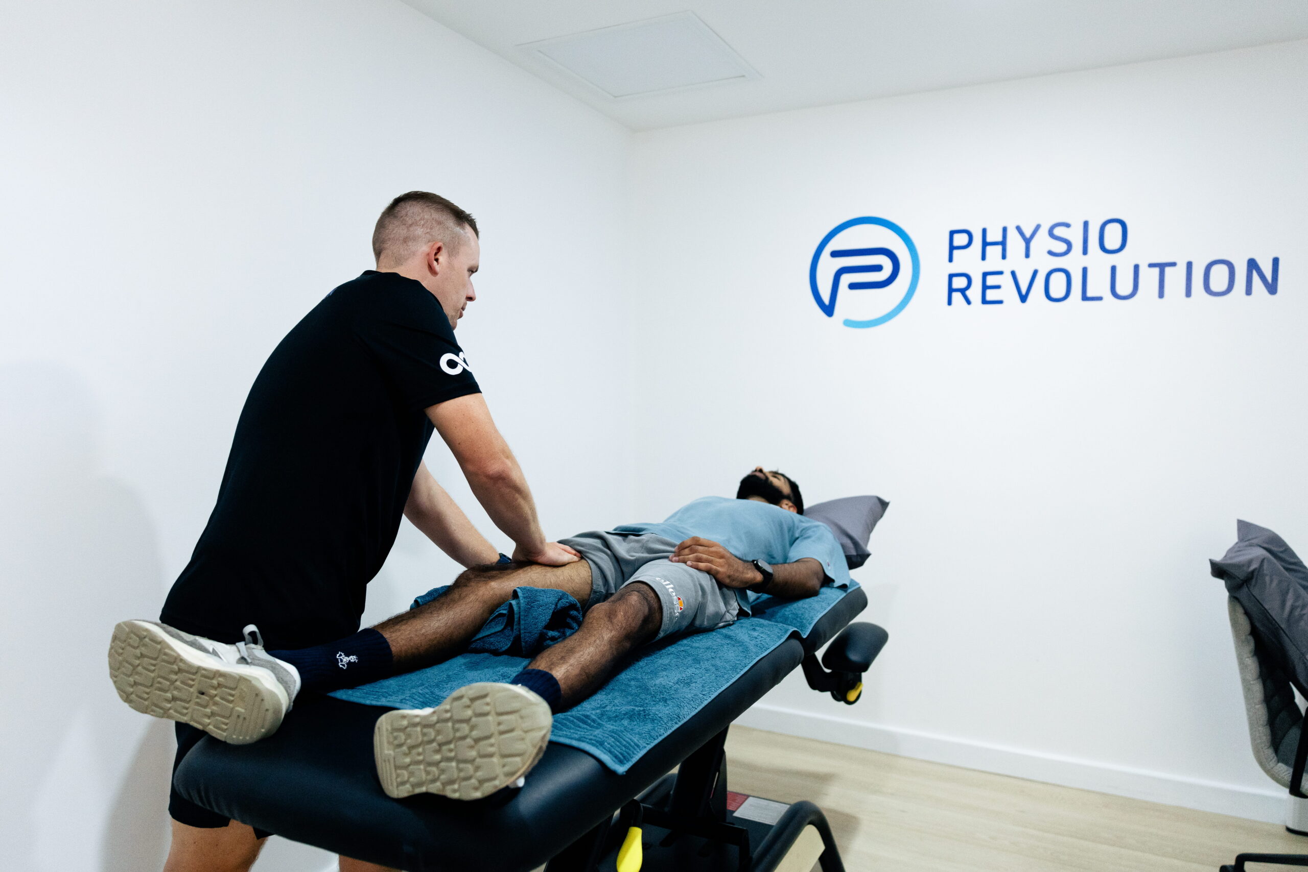 1E4A7191 (1) Physio Matt Beavis, treating a patients knee pain.